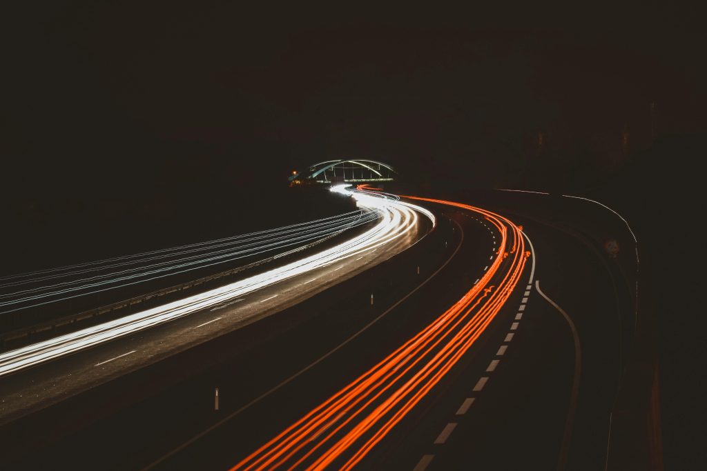 Long exposure of highway light trails captured at night in Mariatal, Tirol, Austria.